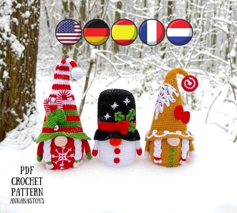 May include: Three crocheted Christmas gnomes, one with a red and white hat, one with a black and white hat, and one with a brown hat. The gnomes are standing on a snowy surface.  PDF CROCHET PATTERN ANNANASTOYS