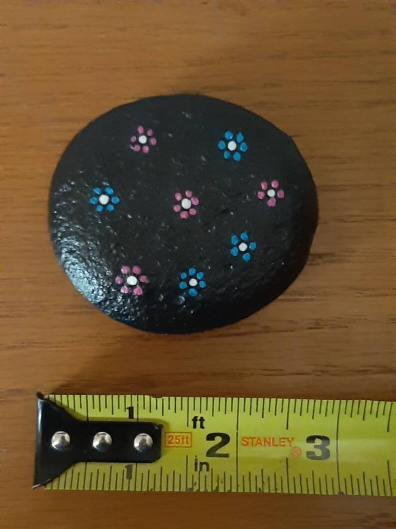 Handpainted flowers on river rock
