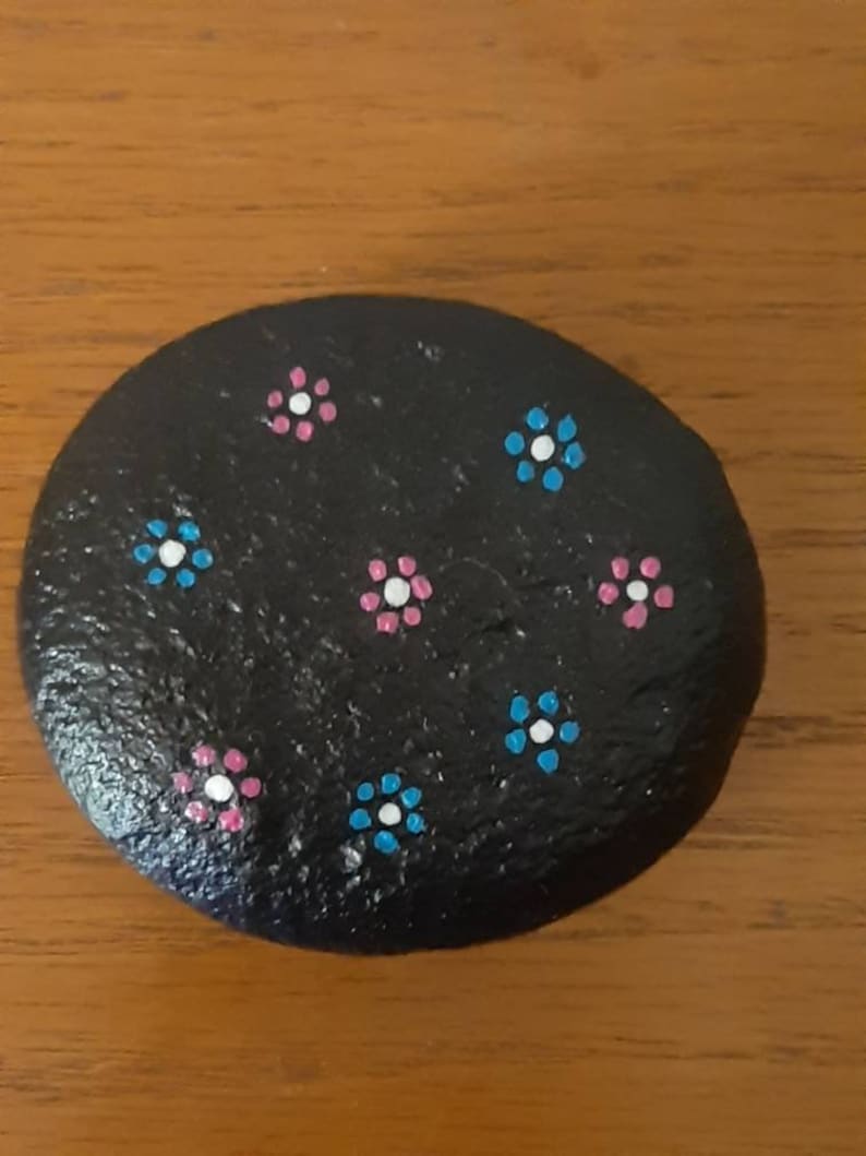 Handpainted flowers on river rock