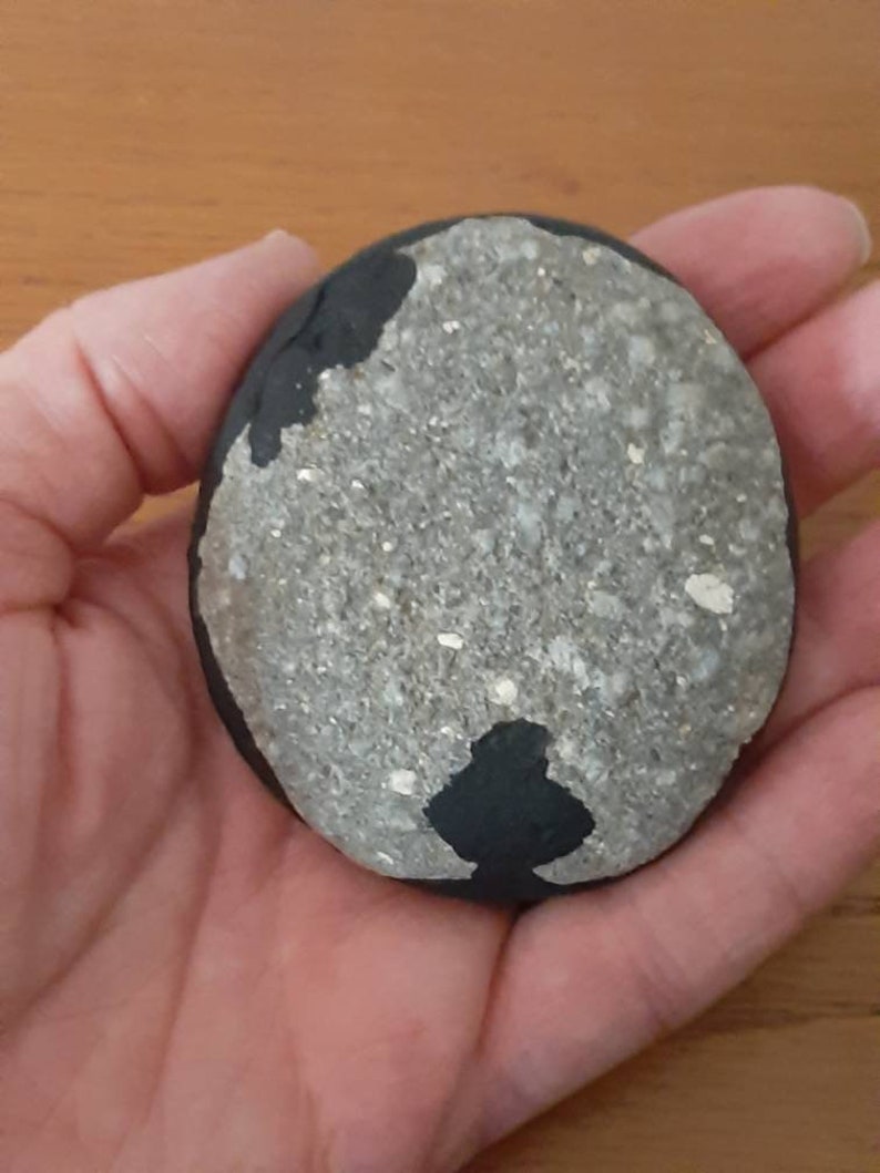 Handpainted flowers on river rock