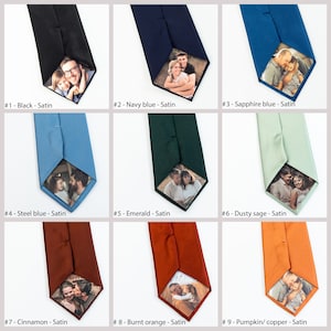 May include: Nine different color satin ties with a photo insert in the bottom tip of the tie. The photo insert shows a family of three.