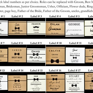 This picture shows example of different personalized labels that can be optionally purchased and are wrapped around ties. The labels has name, wedding role, wedding date and an optional message like tie to suit up or groomsmen proposal label.