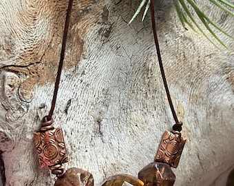Czech glass and copper necklace, root beer Czech glass hand strung on leather necklace.