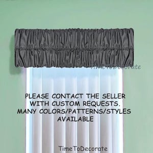 May include: A gray, pleated valance with a ruffled edge. The valance is hanging above a window with white blinds. The text "PLEASE CONTACT THE SELLER WITH CUSTOM REQUESTS. MANY COLORS/PATTERNS/STYLES AVAILABLE" is printed below the valance. The text "Time To Decorate" is printed below the text.