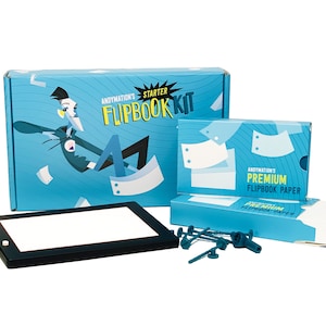 May include: A blue and white box with the text "Andymotion's Starter Flipbook Kit" on it.  A smaller blue and white box with the text "Andymotion's Premium Flipbook Paper" on it. A black light pad with a white surface.  A stack of white paper and a set of green plastic tools.