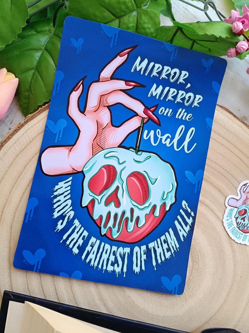 May include: A blue card with the text "Mirror, Mirror on the wall, Who's the fairest of them all?" features a hand with long red nails holding a poisoned apple with a skull design.
