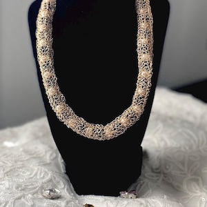 Crochet wire necklace caging white and black beads . Handmade with Love!
