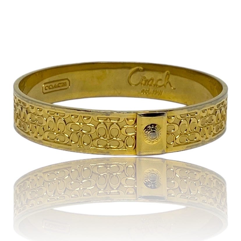 Buy the Designer Coach Gold-Tone Signature Studed Classic Wide Bangle  Bracelet | GoodwillFinds