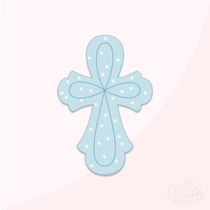 May include: A light blue cross with white polka dots. The cross is a simple design with rounded edges.