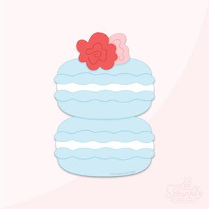 Puede incluir: Dos macarons de color azul claro con glaseado blanco, coronados con una flor roja y rosa.