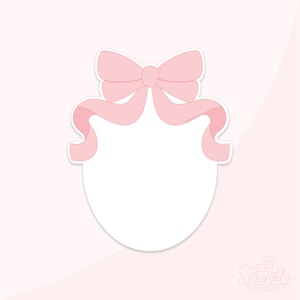 May include: A pink bow with a white circle in the center. The bow is tied with a ribbon that is curled on both sides. The circle is blank and can be used for a photo or other design.