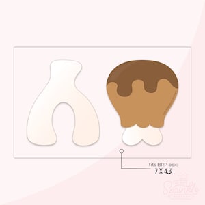 May include: Two cookie cutters, one shaped like a chicken drumstick with brown icing and the other shaped like a horseshoe. The cookie cutters are on a white background with a text overlay that says "fits BRP box: 7 x 4.3" and "The Sprinkle Factory".