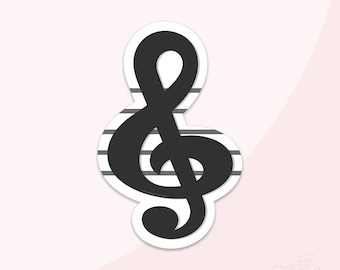 May include: A black treble clef sticker with a white border, set against a light pink background. The clef is positioned over a series of gray horizontal lines, suggesting musical staff lines. The Sprinkle Factory logo is in the bottom right corner.