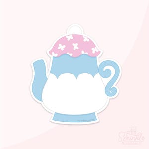 Puede incluir: Una tetera azul y rosa con una tapa blanca y un diseño floral. La tetera tiene un asa y un pico. La tetera es una plantilla imprimible.