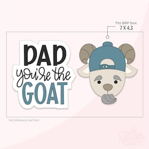 May include: A goat-shaped cookie cutter with a blue baseball cap, next to text that reads "DAD you're the GOAT". The cutter fits a 7 x 4.3 inch box. The Sprinkle Factory logo is in the bottom right.