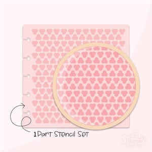 May include: A pink stencil set with a repeating clover-like pattern. The stencil is shown with a magnifying glass effect, and the text "1 Part Stencil Set" is visible. The Sprinkle Factory logo is in the bottom right corner.
