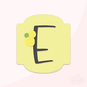 May include: A light yellow, rounded rectangle with a black letter "E" in the center. The letter is decorated with yellow and green floral accents. The background is a soft pink.