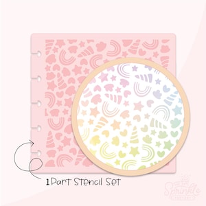 May include: A pink 1-part stencil set featuring a repeating pattern of hearts, stars, rainbows, and unicorn horns. A circular inset shows a rainbow gradient of the same design. The text "1 Part Stencil Set" is visible.