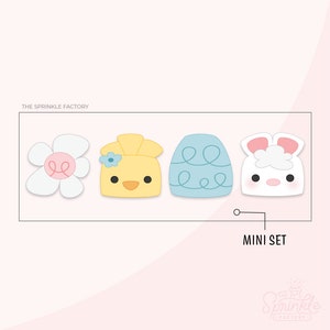 May include: A set of four mini Easter cookie cutters, featuring a yellow chick, a blue egg, a white bunny, and a white flower. The cutters are arranged in a row and labeled "MINI SET".