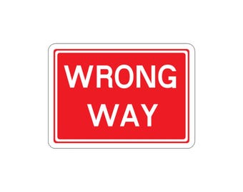 May include: A rectangular sign with a bright red background and a white border. The text WRONG WAY is printed in bold, white, uppercase letters in the center of the sign. The sign has rounded corners and a clean, high-contrast design.