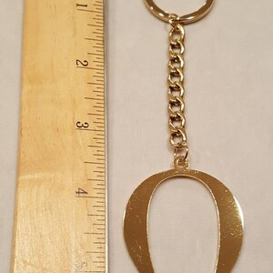 OMEGA SYMBOL KEYCHAIN - Etsy