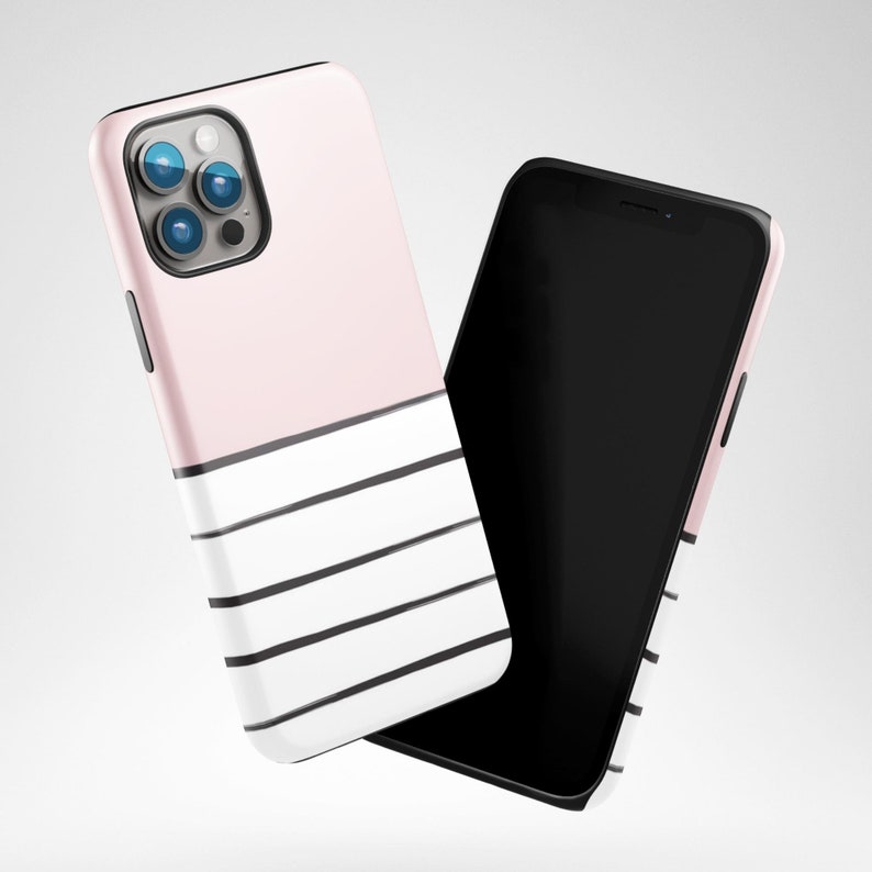 May include: A pink and white phone case with black stripes. The case is designed for a smartphone with a triple lens camera.