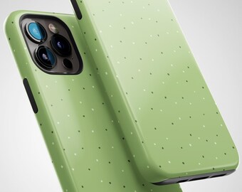 May include: Two green phone cases with a white polka dot pattern. The cases are made of a soft, flexible material and have a matte finish.