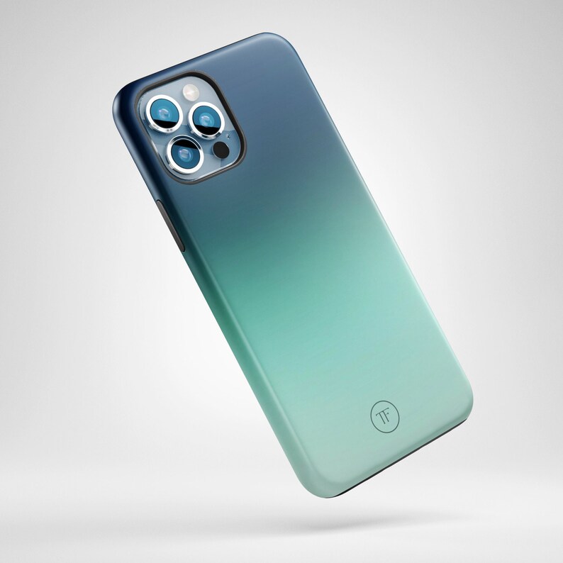 May include: A blue and green gradient phone case with a camera lens cutout and a small "TF" logo.