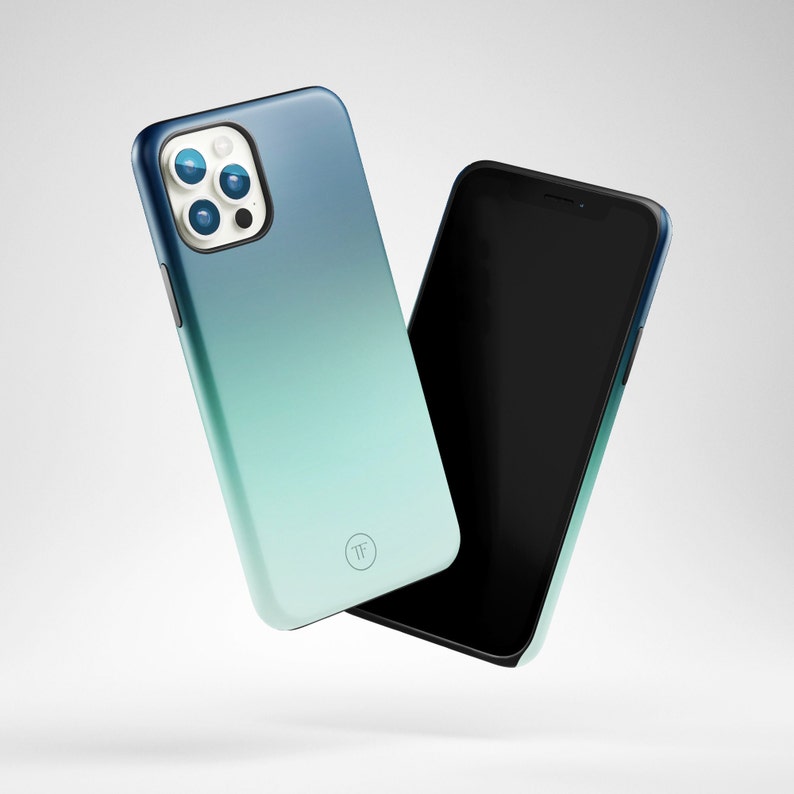 May include: A blue and green gradient phone case with a camera lens cutout and a small logo. The case is shown next to a black phone with a blank screen.