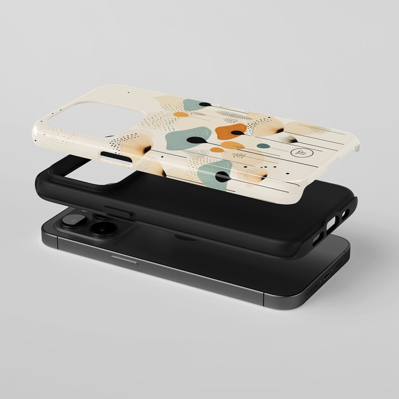 K&ouml;nnte beinhalten: Eine wei&szlig;e Handyh&uuml;lle mit einem farbenfrohen abstrakten Blumendesign. Die H&uuml;lle ist von einem schwarzen Handy getrennt dargestellt.