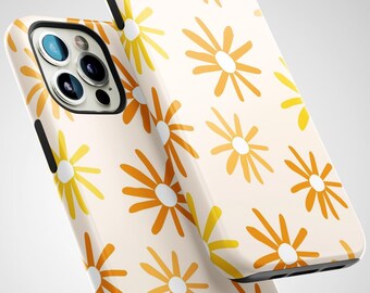 May include: Two phone cases with a repeating pattern of orange and yellow daisy-like flowers on a cream background. The cases have black trim and are angled towards the viewer, showcasing the design and the phone's camera.