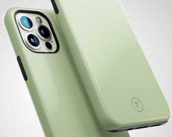 May include: A light green phone case with a black border and a small circle logo with the letters "TF" in the center.
