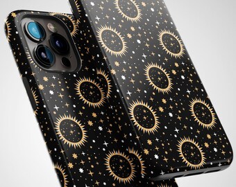 May include: Black phone case with a gold and white pattern of stars and suns.