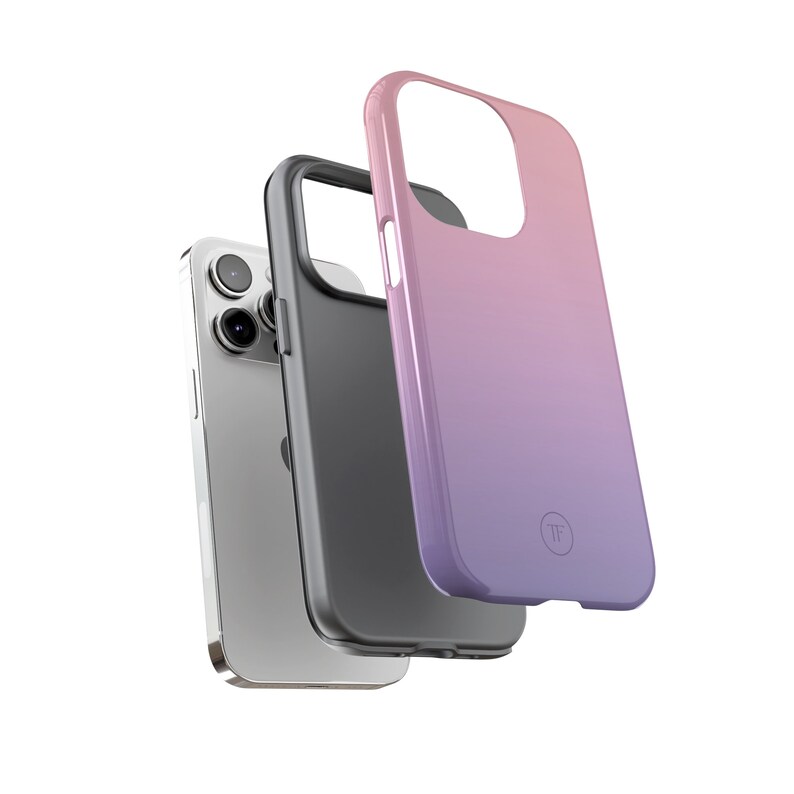 May include: A pink and purple gradient phone case with a clear logo on the back. The case is shown with a black phone case and a silver phone.