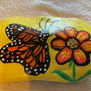 Large Hand painted Butterfly rock with flower. Pretty monarch butterfly painted in acrylics and sealed on a Lake Erie shores rock.