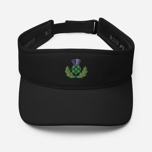 May include: Black visor with an embroidered green and purple thistle design.