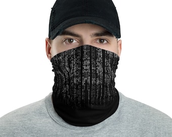 May include: A black face mask with a white matrix code pattern. The mask is worn by a person with a black baseball cap.