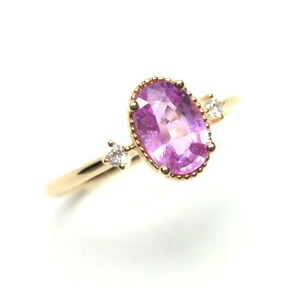 A lovely Pink Sapphire and Diamond Trilogy ring