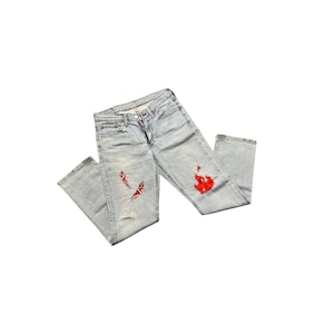 May include: Light blue denim jeans with red and white bandana patches on the knees.