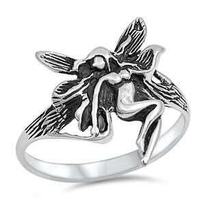 May include: A silver ring featuring a detailed fairy design with wings outstretched. The fairy is depicted in a sitting position with its wings spread wide.