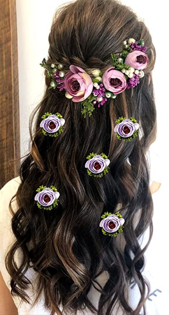 Messy braids with floral accessories Latest hairstyles for Indian brides   Pelli Poola Jada