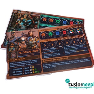 May include: A close-up of a board game card with a brown and orange background. The card features a group of characters with a futuristic aesthetic. The card is titled "Aldecaldos" and includes information about the game's rules and mechanics.