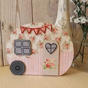 Retro caravan decorative ornamental plaque. Vintage caravan camping with bunting, heart window.
