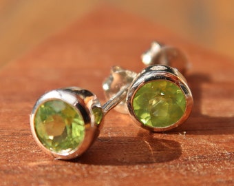 Dainty silver earrings with two very powerful peridot gemstones in light green, green peridot in a double pack!