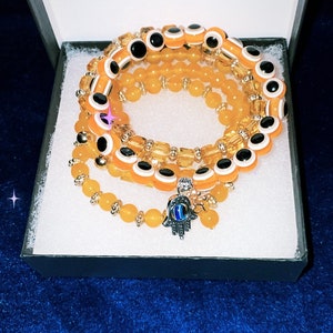 Evil Eye Protection orange glam crystal stack set