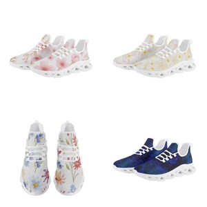 May include: Four pairs of white sneakers with different floral and abstract patterns. The sneakers have a unique, chunky sole design.