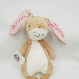May include: A brown plush bunny with pink ears. The ears are embroidered with the text "Ella K craft" and "Born in 2020 Year of Lockdown".