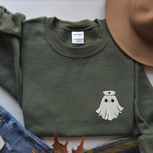 Embroidered nurse doctor ghost halloween sweatshirt in the colour military green