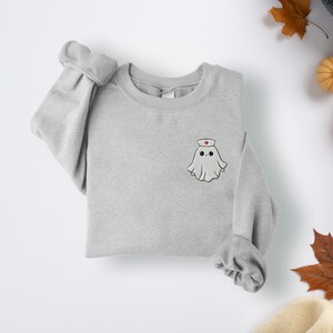 Embroidered nurse doctor ghost halloween sweatshirt in the colour sport grey