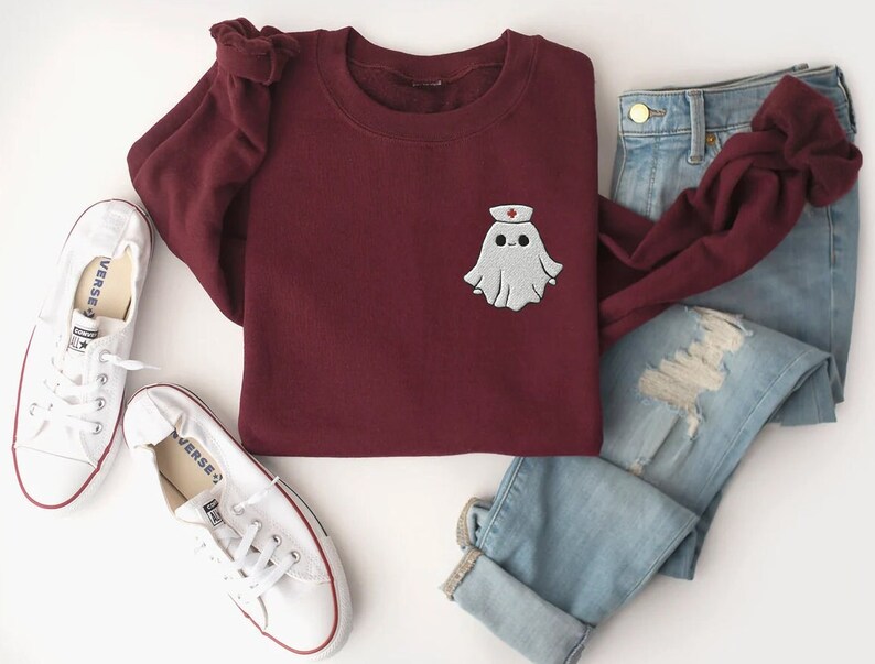 Embroidered nurse doctor ghost halloween sweatshirt in the colour maroon